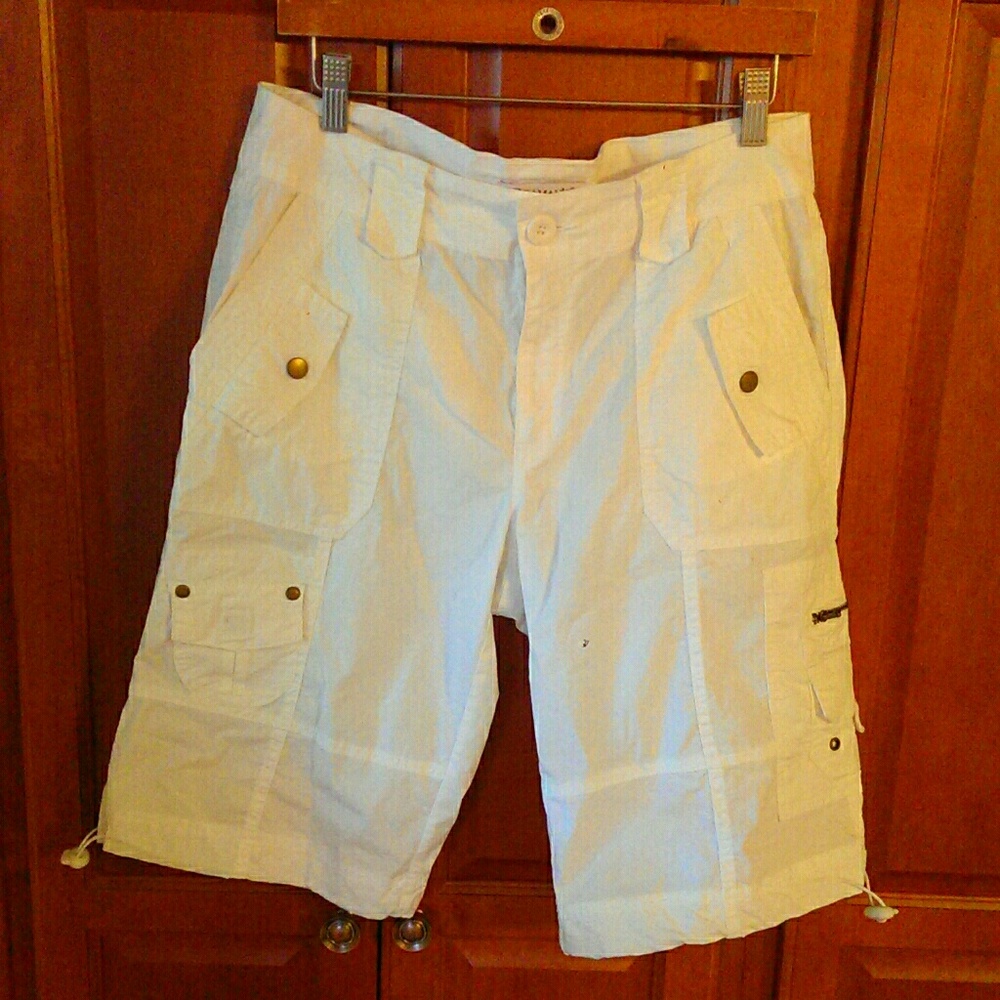 White Bermuda length cargo shorts.